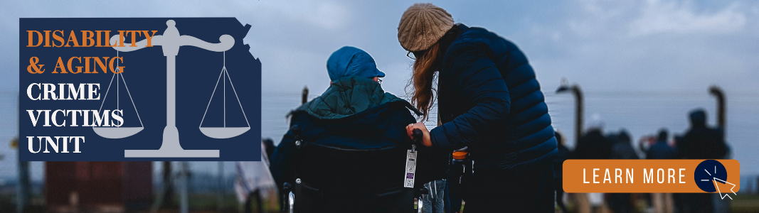 Photo from behind a man in a wheelchair wearing a hat. A woman wearing a hat stands next to him. They are both looking at a blue sky. A navy blue logo in the shape of Kansas is over the image reading "Disability & Aging Crime Victims Unit." On the lower right of the photo, a graphic reads "LEARN MORE" with an icon of a computer mouse.